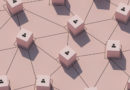Une vue en plongée d'un réseau interconnecté composé de petits cubes rose pâle reliés par des lignes noires